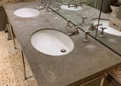 A bathroom with two sinks and a mirror