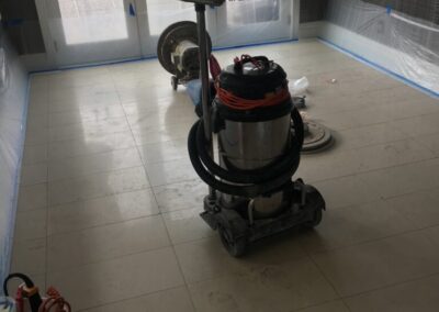 A room that has a vacuum on the floor