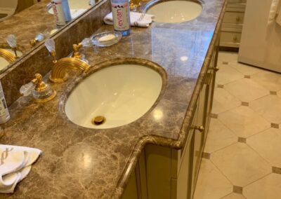 A bathroom with two sinks and a large mirror