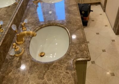 A bathroom with two sinks and a large mirror