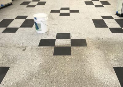 A room with a checkered floor and black and white tiles