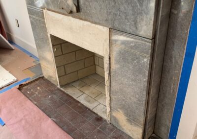 A fire place being installed in a living room